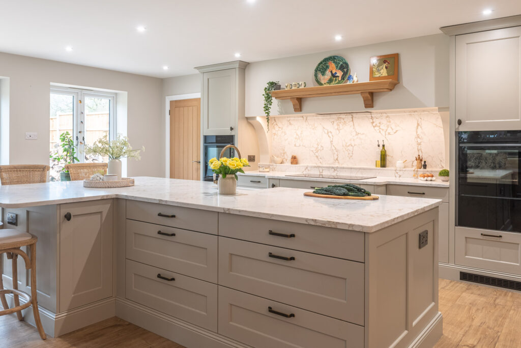 Modern white shaker style kitchen with elegant design features.